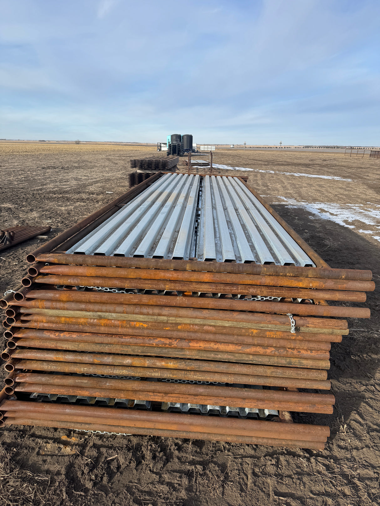 25' Windbreaks laying down stacked in pasture